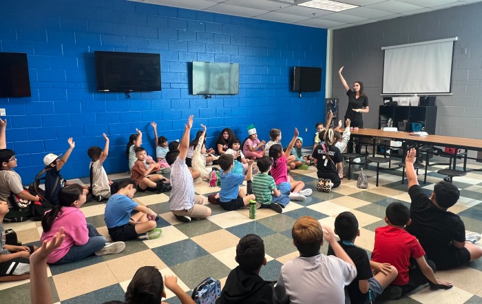 Red Square Dental & Orthodontics team visiting the Boys & Girls Club of McAllen for Career Week to teach kids about dental hygiene.